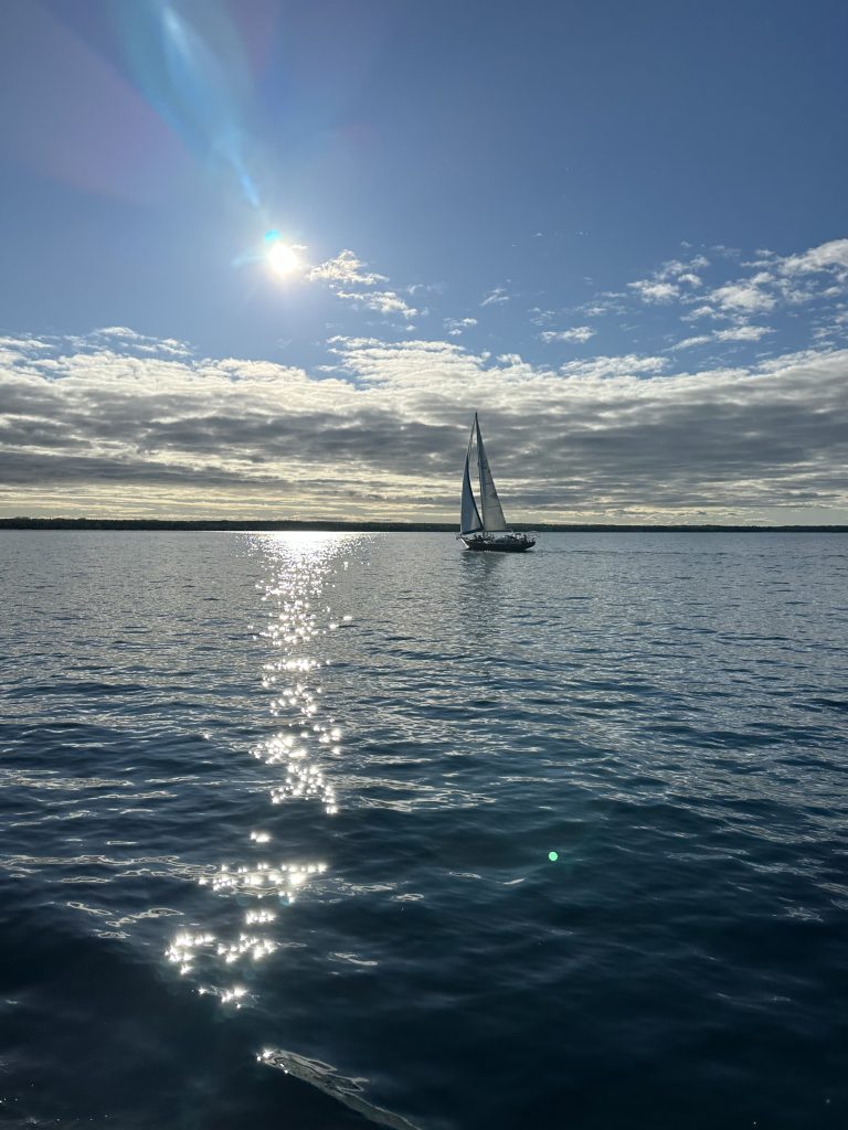 Sailboat deck view on Windy Escape during a Mackinac Island sailing charter on Lake Huron.