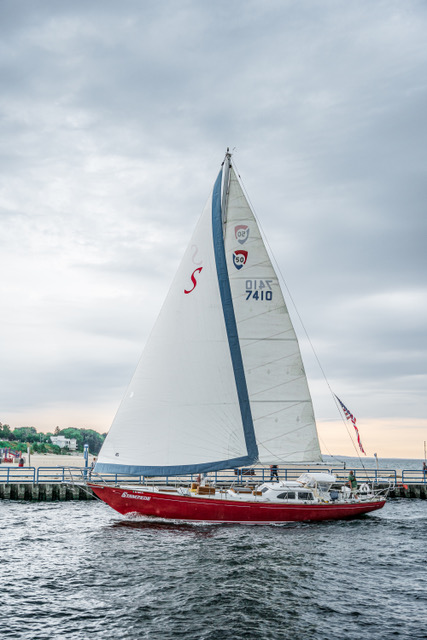 Windy Escape sailboat cruising near Mackinac Island with passengers enjoying a scenic Lake Huron sailing tour.
